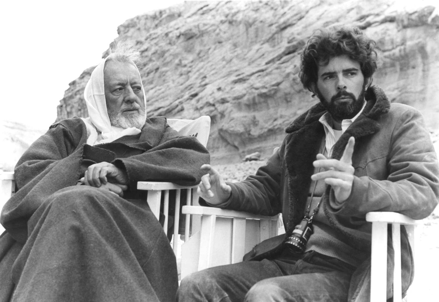 British actor Alec Guinness with American director, screenwriter and producer George Lucas on the set of his movie Star Wars: Episode IV - A New Hope.