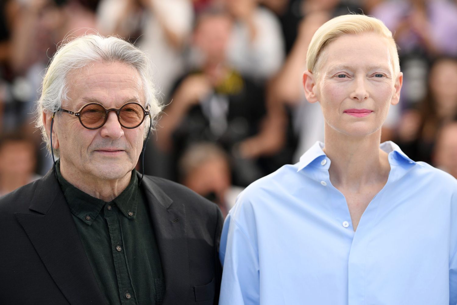 CANNES, FRANCE - MAY 21: (L to R) Director George Miller and Tilda Swinton attend the photocall for "Three Thousand Years Of Longing (Trois Mille Ans A T'Attendre)" during the 75th annual Cannes film festival at Palais des Festivals on May 21, 2022 in Cannes, France. (Photo by Pascal Le Segretain/Getty Images)