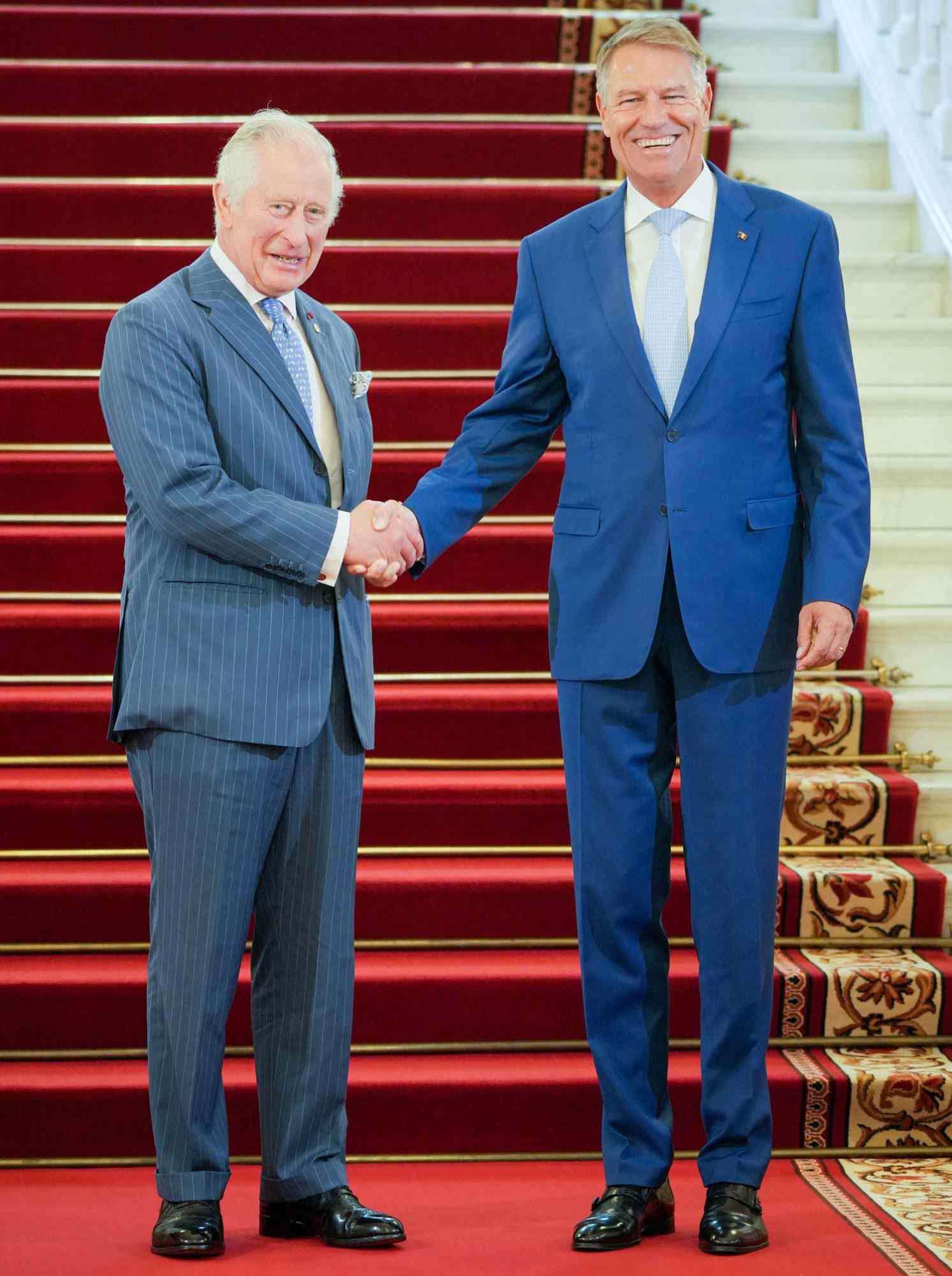 Prince Charles, Prince of Wales (L) is welcomed by Romanian President Klaus Iohannis at the Cotroceni Palace, the Romanian Presidency headquarters in Bucharest, Romania