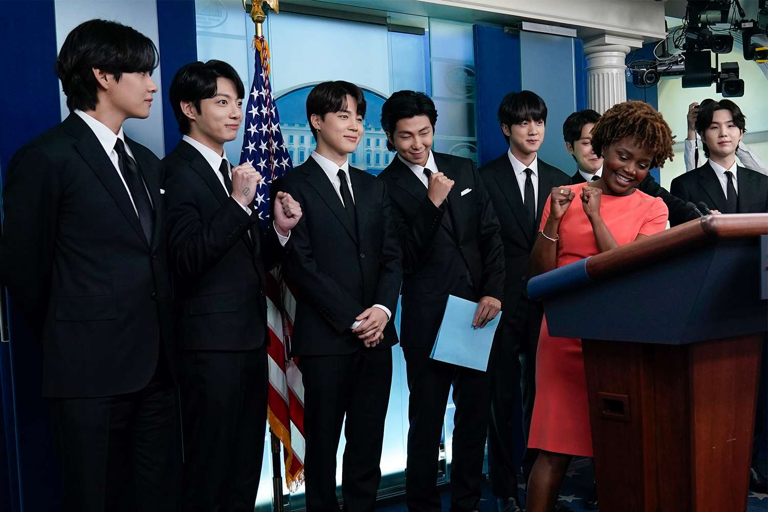 Members of the K-pop supergroup BTS, from left, V, Jungkook, Jimin, RM, Jin, J-Hope, Suga, join White House press secretary Karine Jean-Pierre during the daily briefing at the White House in Washington, Tuesday, May 31, 2022.