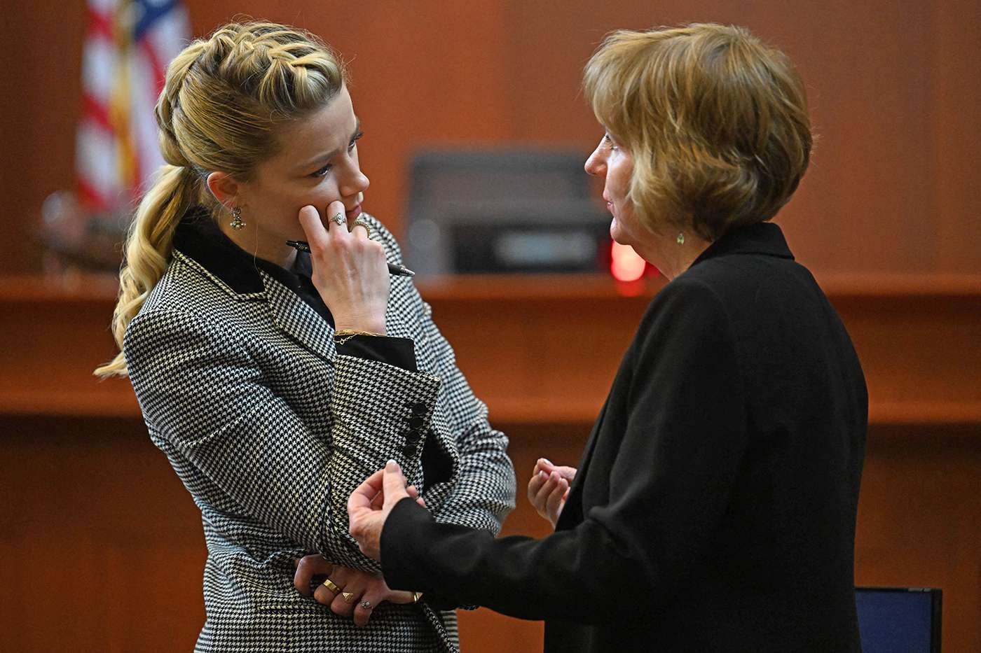 US actress Amber Heard talks to her lawyer Elaine Bredehoft