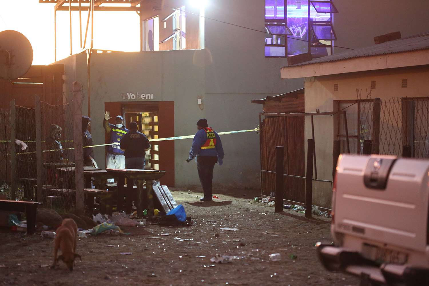 South African Police Forces (SAPS) and forensics experts work at the scene where an estimated 20 young people died in Enyobeni Tavern in East London, South Africa