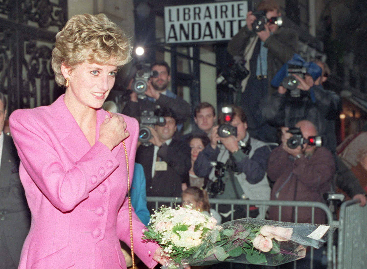 PARIS, FRANCE - NOVEMBER 14: Picture dated 14 November 1992 of Princess Diana leaving the first anti-AIDS bookshop in Paris. Diana, Princess of Wales died in hospital early 31 August after a midnight car crash in central Paris in which her friend the Egyptian millionaire film-producer Dodi al-Fayed and driver were also killed. At the time of the crash, the car was being pursued by paparazzi press photographers on motorcycles. (Photo credit should read VINCENT AMALVY/AFP via Getty Images)