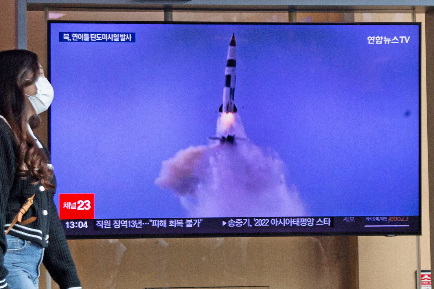 Mandatory Credit: Photo by JEON HEON-KYUN/EPA-EFE/Shutterstock (13430546a) A woman watches the news about a North Korea ballistic missile launch, at a station in Seoul, South Korea, 30 September 2022. According to South Korea's Joint Chiefs of Staff (JCS), Pyongyang launched two more ballistic missiles towards the East Sea on the evening of 29 September, hours after the US vice president met with South Korea's head of state in Seoul. Two more missiles were also tested on 28 September. North Korea carries out back-to-back ballistic missile tests, Seoul - 30 Sep 2022