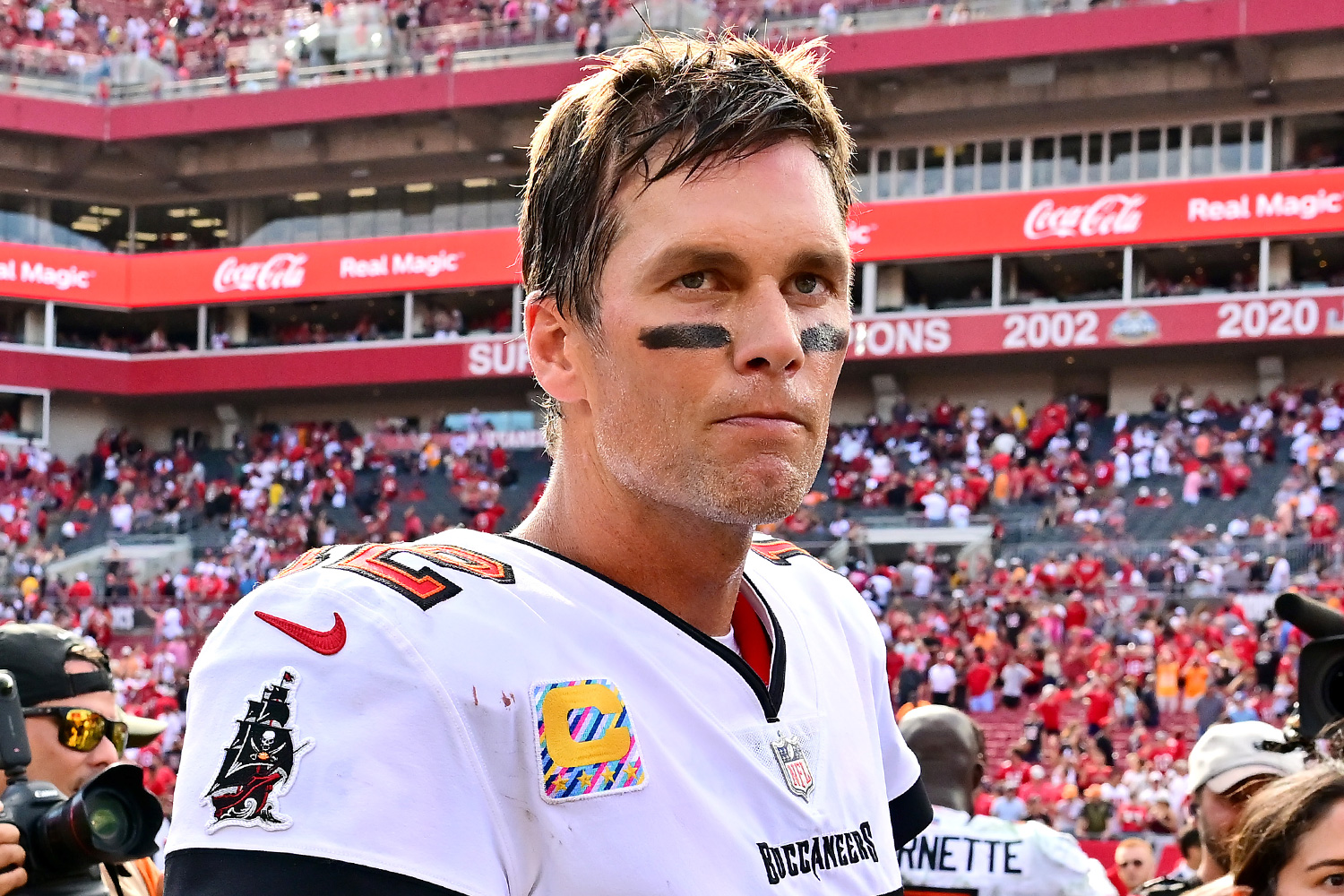 Tom Brady #12 of the Tampa Bay Buccaneers walks off the field after defeating the Atlanta Falcons 21-15 at Raymond James Stadium on October 09, 2022 in Tampa, Florida.