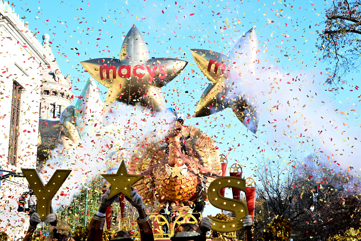Dancers cut the ribbon at the start of the 96th-annual Macys Thanksgiving Day Parade