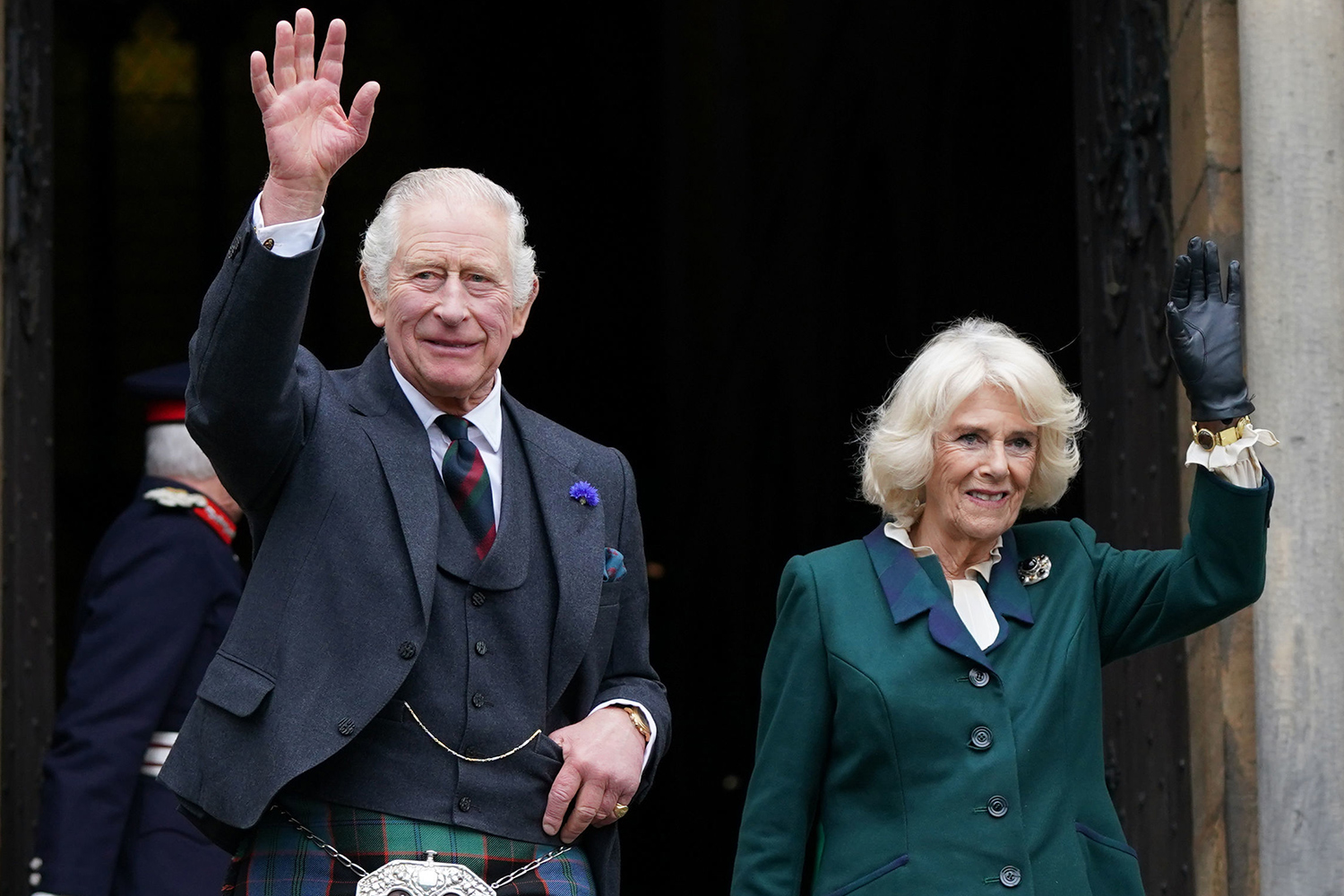 King Charles III and Camilla, Queen Consort, waves as they leave Dunfermline Abbey, after a visit to mark its 950th anniversary, and after attending a meeting at the City Chambers in Dunfermline where the King formally marked the conferral of city status on the former town on October 3, 2022 in Dunfermline, Scotland.