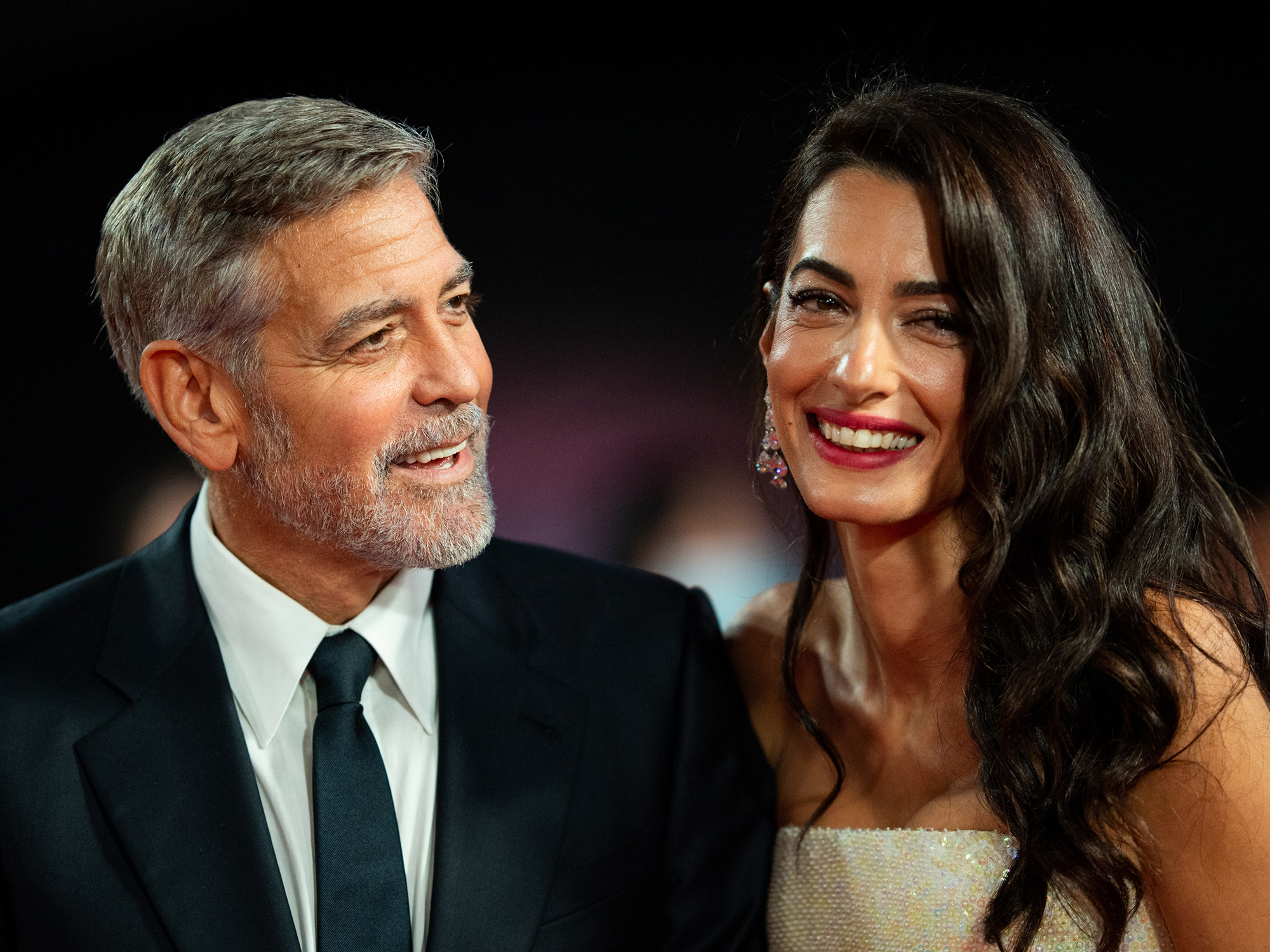 George Clooney and Amal Clooney attend "The Tender Bar" Premiere during the 65th BFI London Film Festival at The Royal Festival Hall on October 10, 2021 in London, England