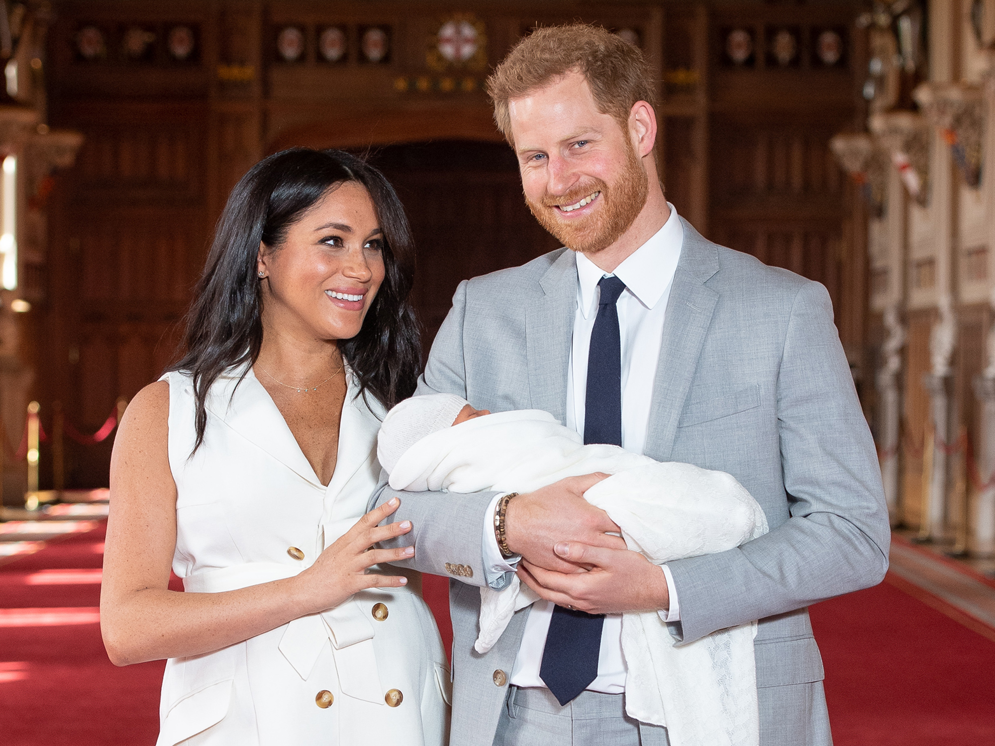 Prince Harry, Duke of Sussex and Meghan, Duchess of Sussex, pose with their newborn son Archie Harrison Mountbatten-Windsor during a photocall in St George's Hall at Windsor Castle on May 8, 2019 in Windsor, England. The Duchess of Sussex gave birth at 05:26 on Monday 06 May, 2019