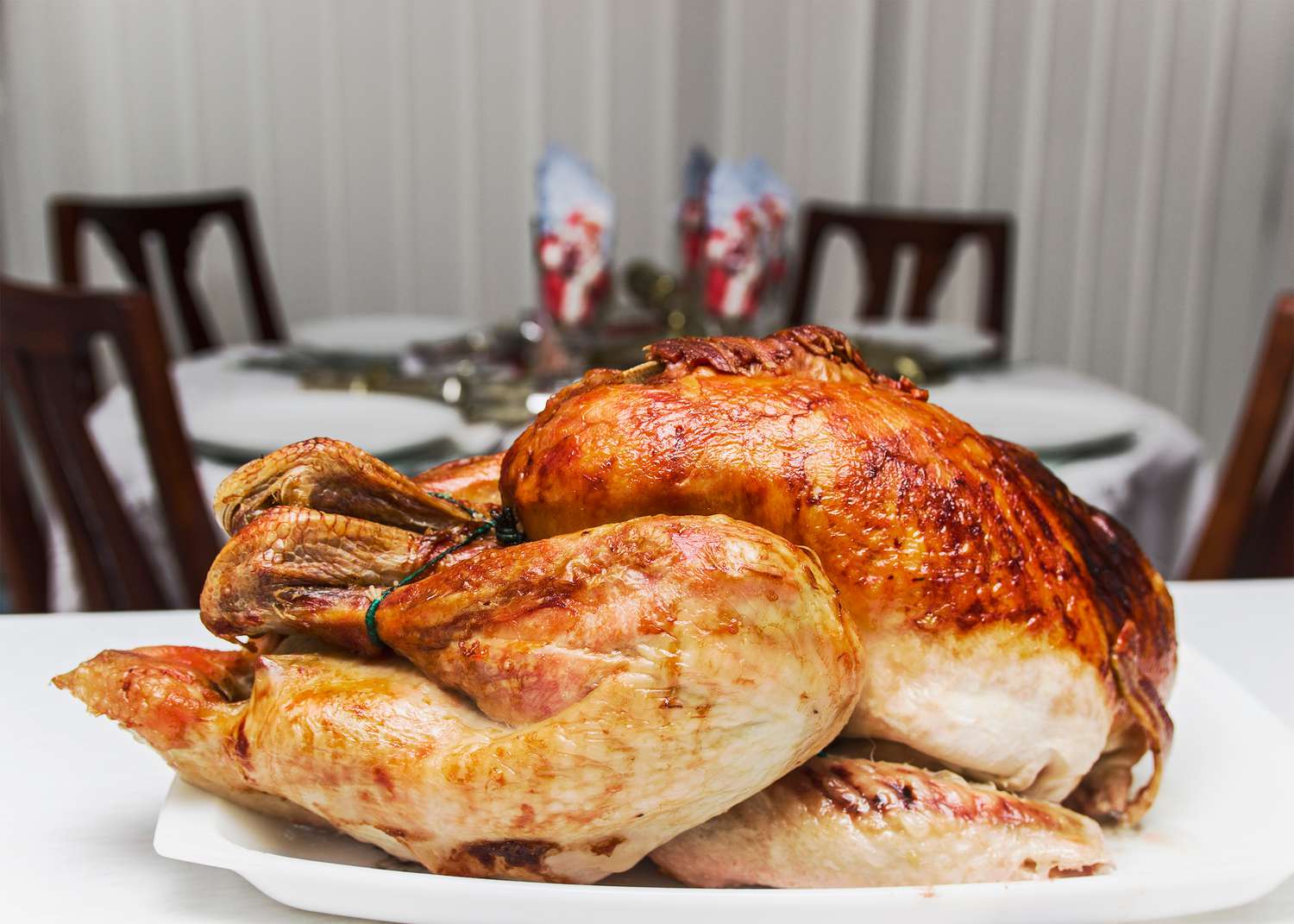 Close-Up Of Roast Turkey Served In Tray On Table At Restaurant
