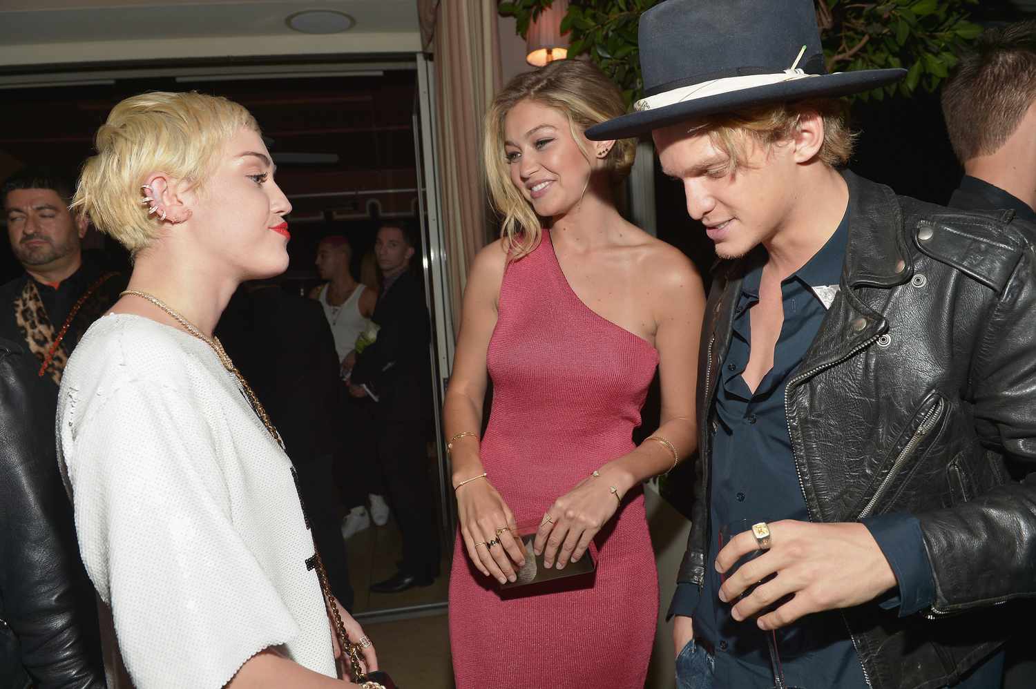 Miley Cyrus, honoree Gigi Hadid (L) and singer Cody Simpson