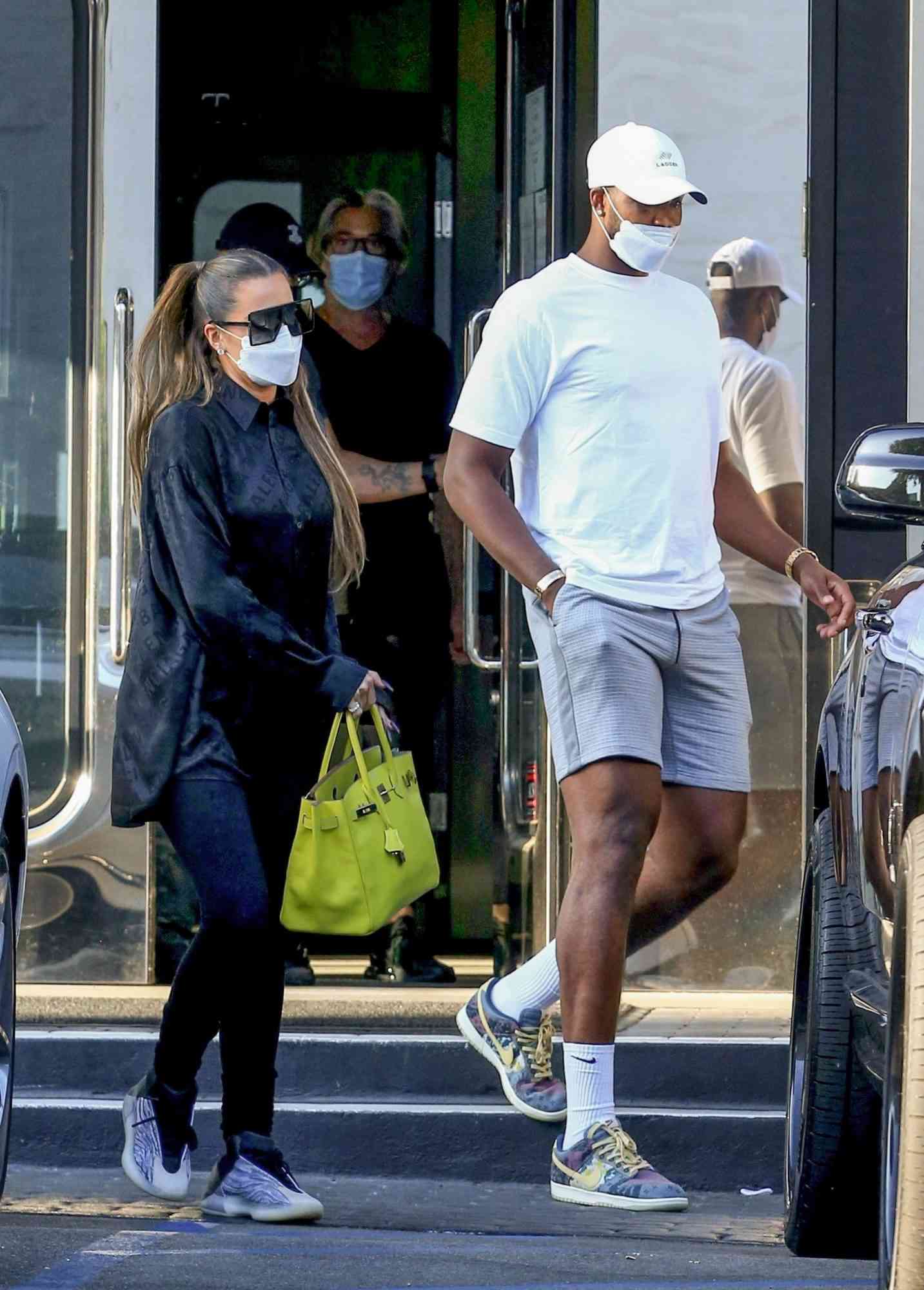 Khloe Kardashian and Tristan Thompson return to their Rolls Royce after some shopping at XIV Karats Ltd in Beverly Hills