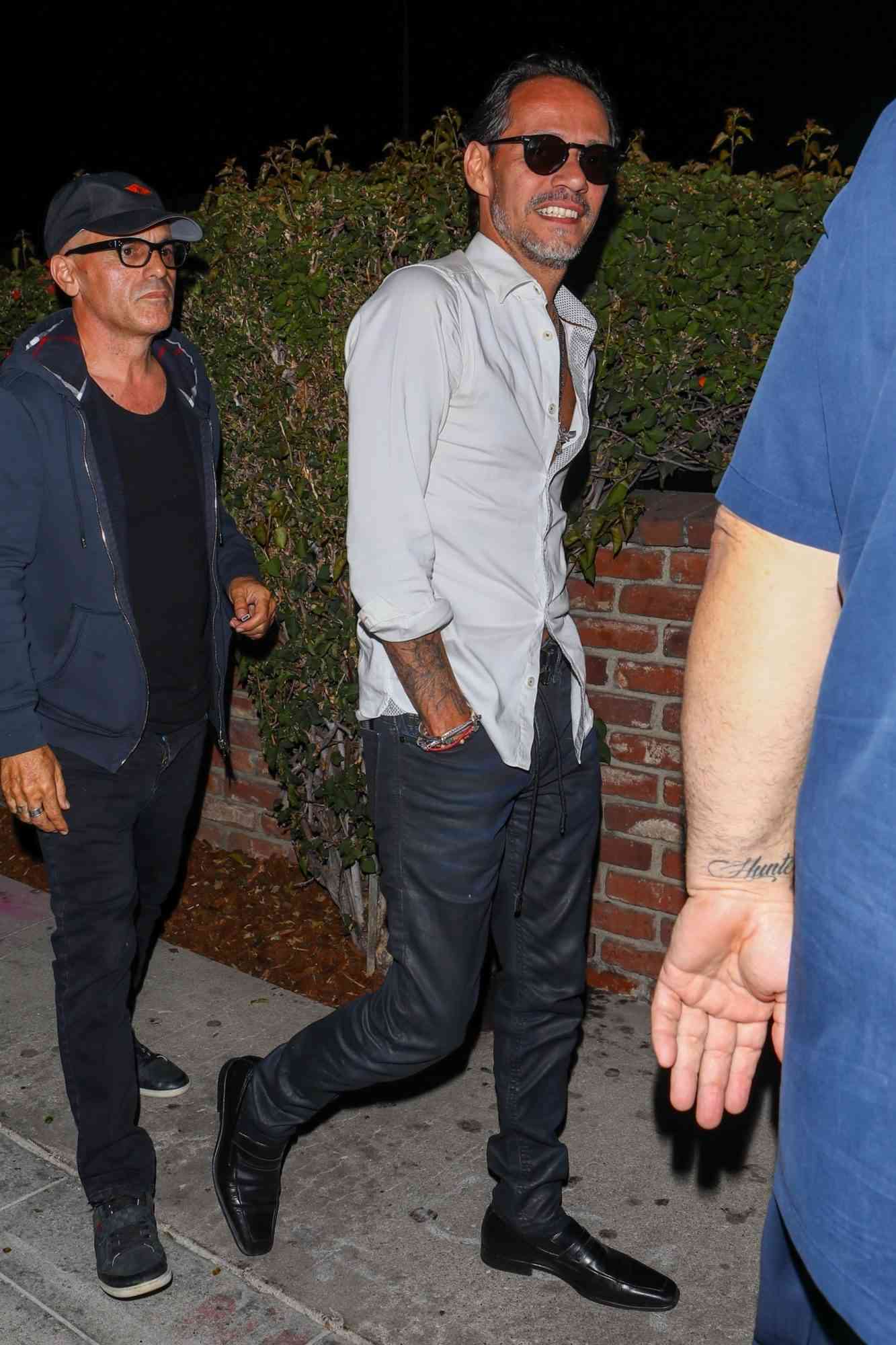Marc Anthony Arrives at Delilah Nightclub with Friends
