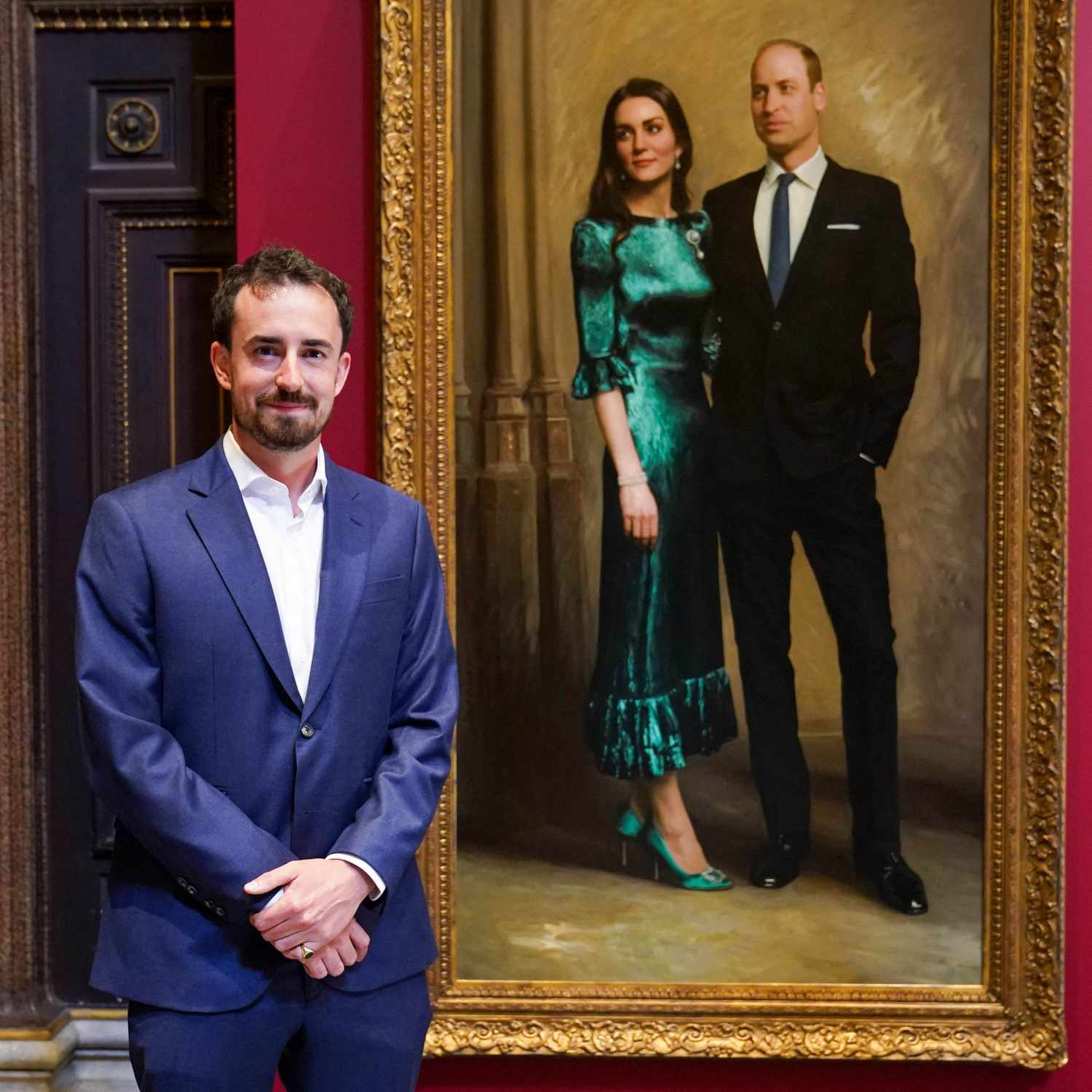 Jamie Coreth poses with his painting of Kate Middleton and Prince William