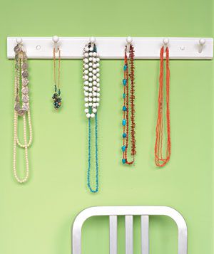 Necklaces hanging on a coat rack