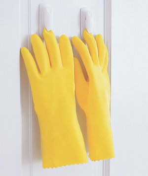 Rubber gloves hanging upside down from clips