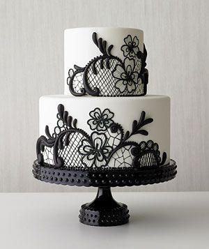 White tiered cake with black lace embellishment