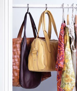 Handbags stored on shower-curtain hooks