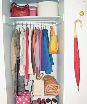 Entryway closet with coats and boots