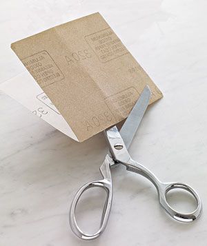 Sandpaper sharpening scissors