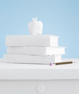Paper construction of apple and books by Matthew Sporzynski