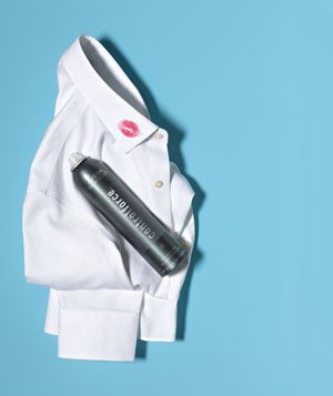 Ironed dress shirt with lipstick on collar and hairspray