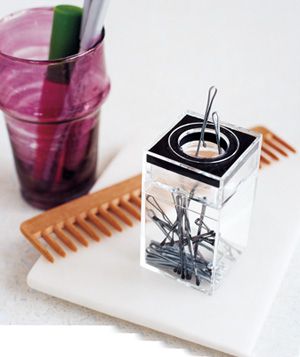 Paper clip dispenser used to stash bobby pins