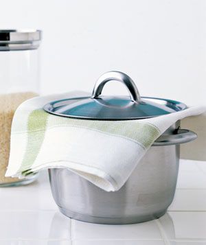 Folded towel absorbs excess moisture from pot