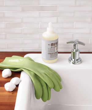 Cotton balls, rubber gloves and soap on a sink