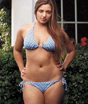 Model wearing patterned blue and white string bikini