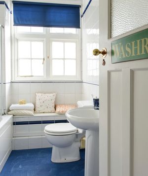 White bathroom with blue shade and floor