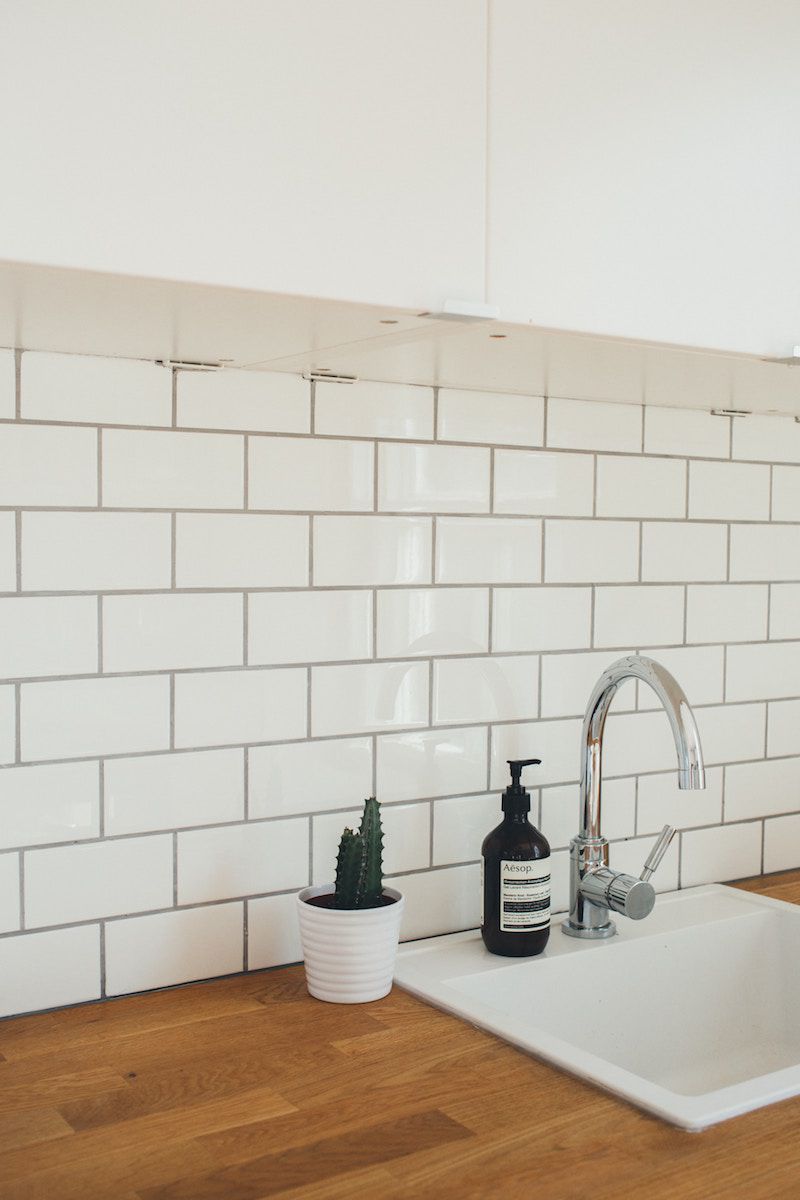How to Clean Bathroom Grout, white tiled bathroom