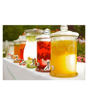 Drink dispensers at outdoor wedding party