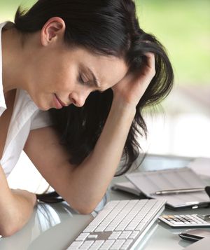 Stressed woman at desk