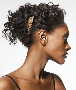 Gold comb in curly hair up-do