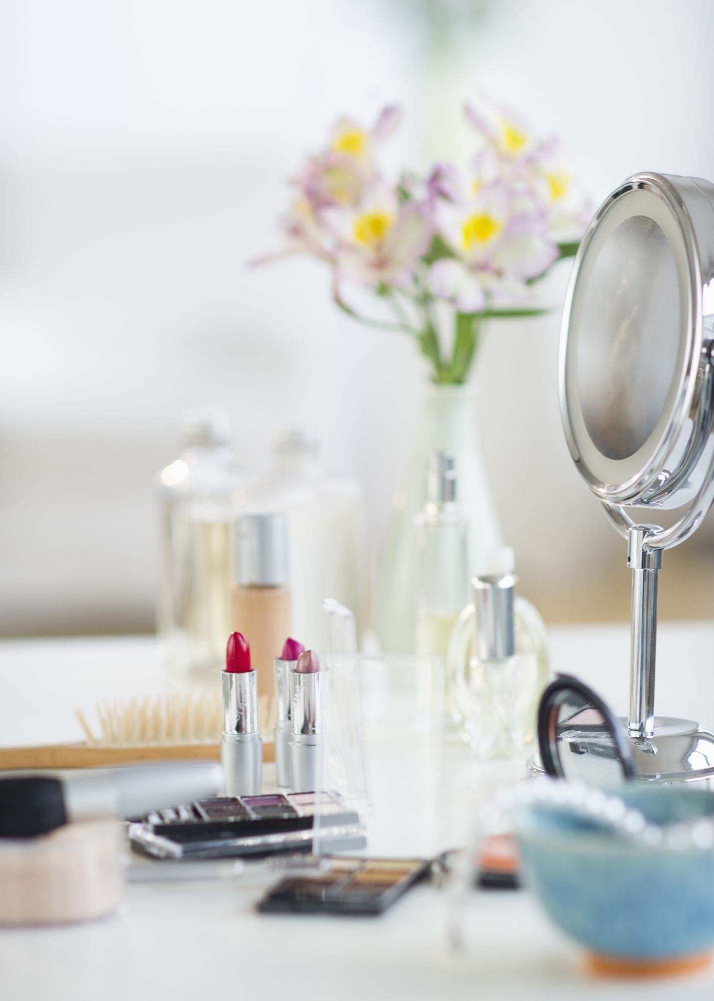Makeup and cosmetics with mirror on white table