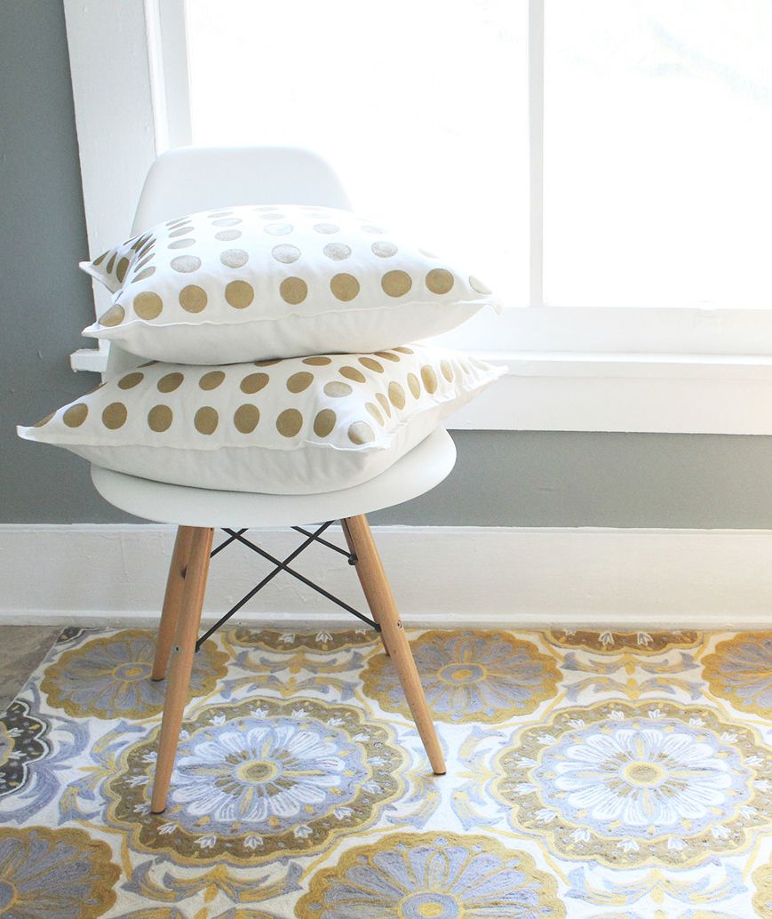 Gold and white polka-dot pillows