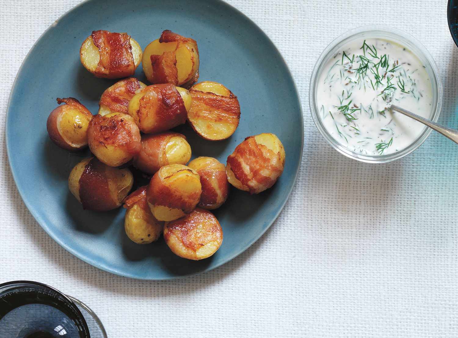 Super Bowl food ideas - snacks, appetizers, and finger foods (Bacon-Wrapped Potatoes With Creamy Dill Sauce)