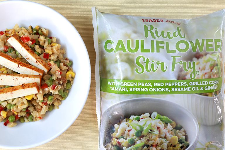 Trader Joe's Riced Cauliflower Stir-Fry package with plate of cooked product beside it