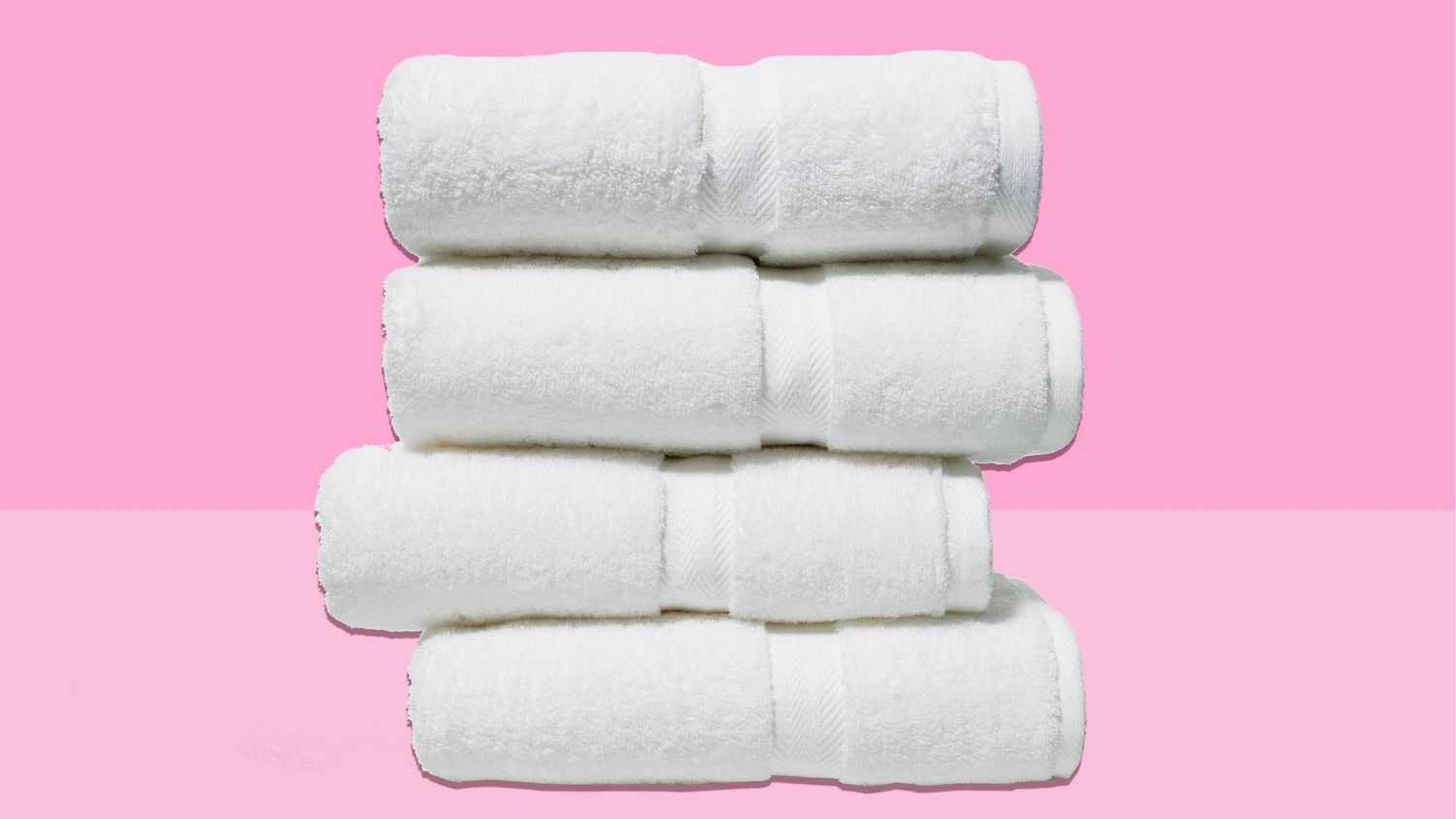 stack of fresh white towels: organizing your home like a hotel