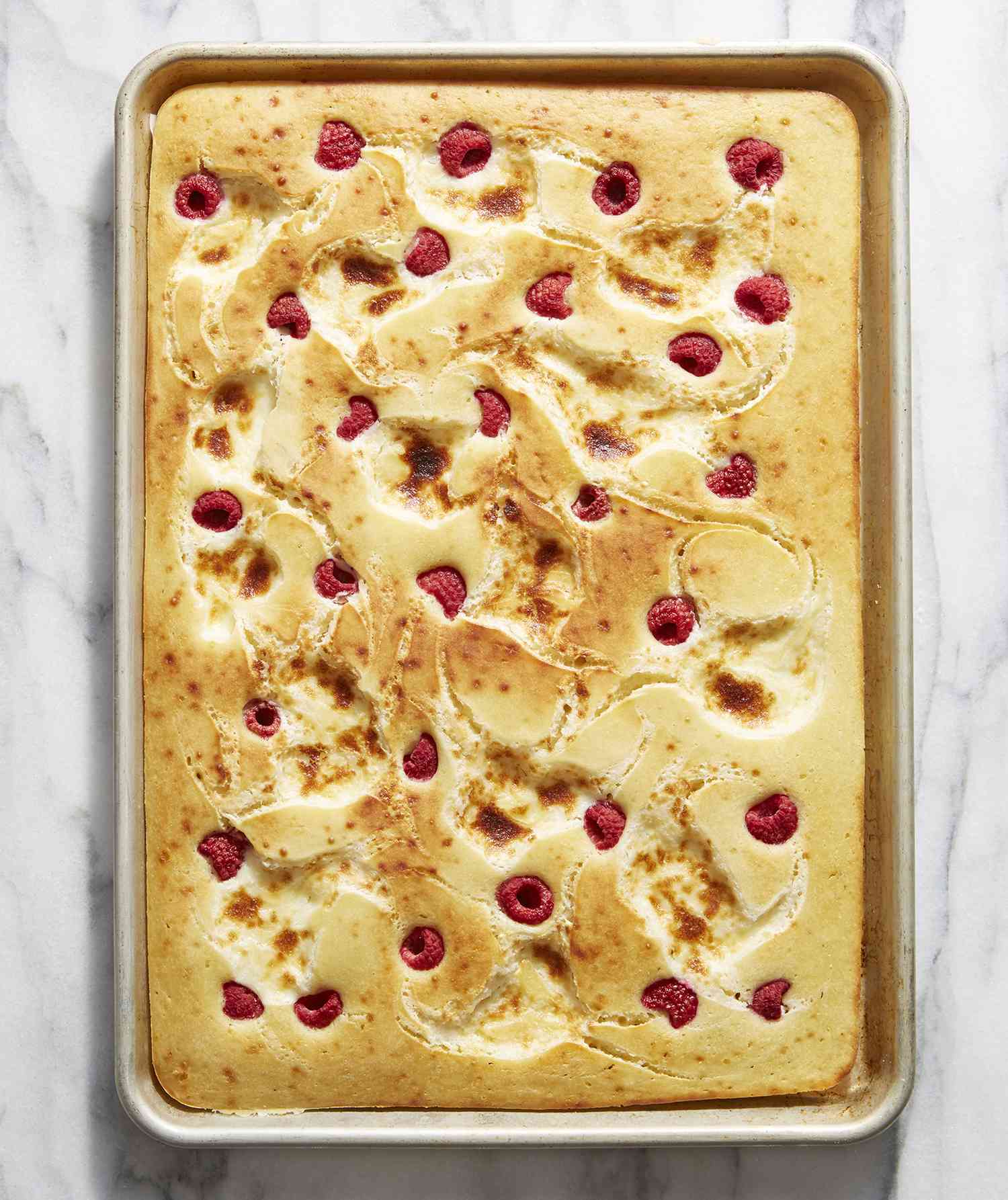 Sheet Pan Pancake With Raspberries and Cream Cheese Swirl