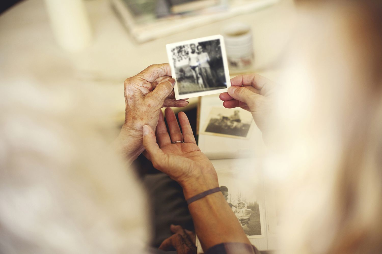 Hands holding old photographs