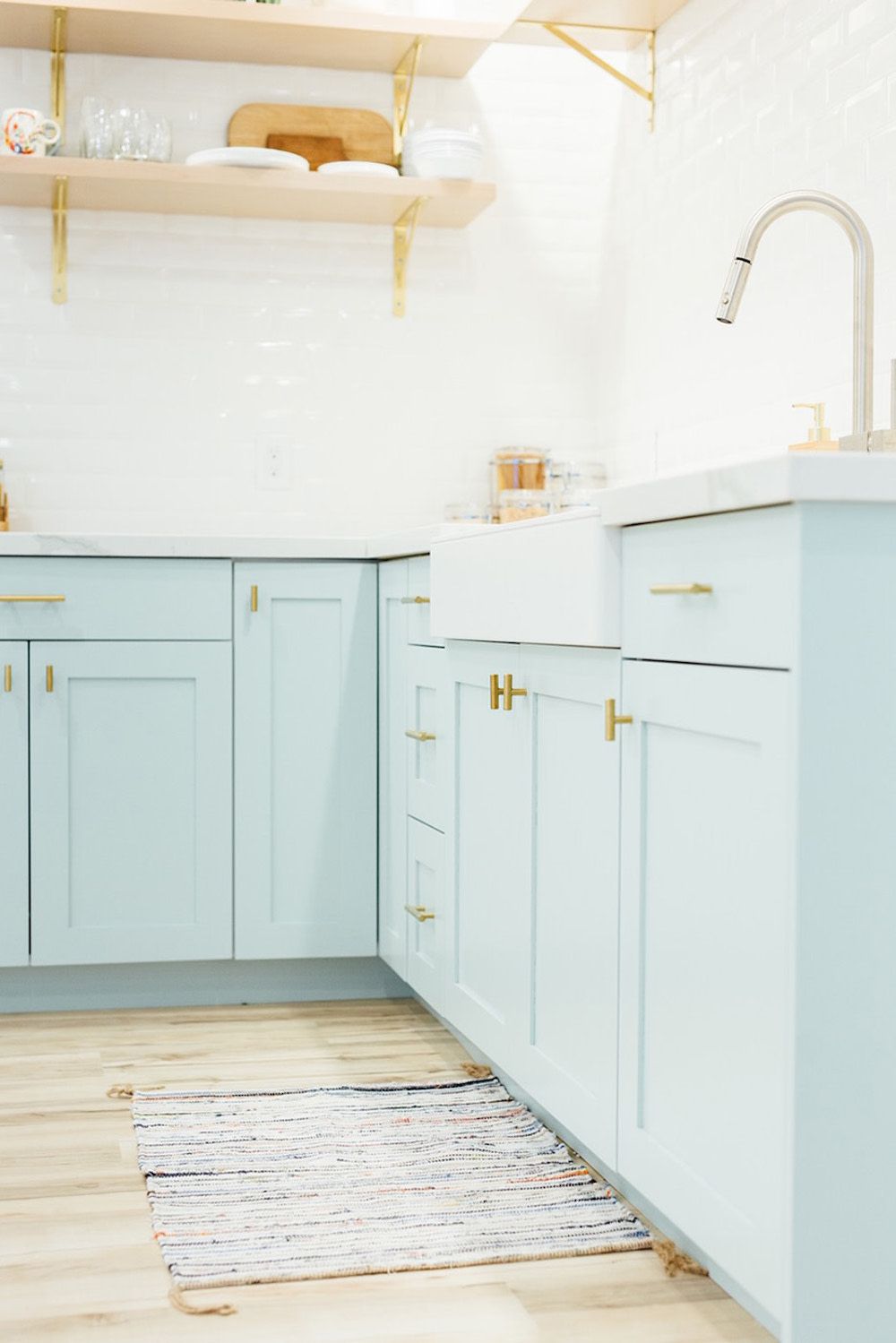 light blue kitchen cabinets and open shelving