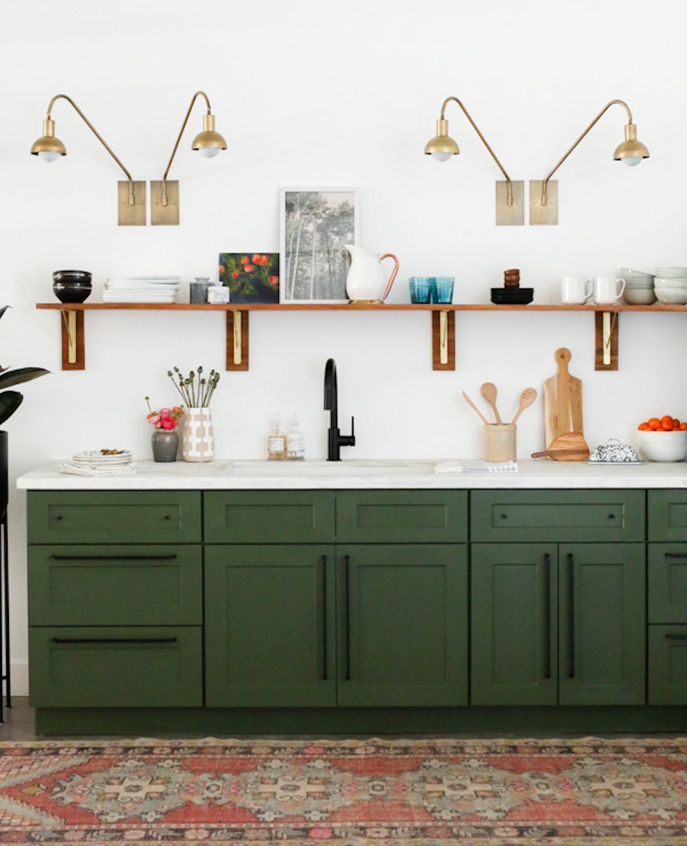 Green kitchen cabinet in kitchenette