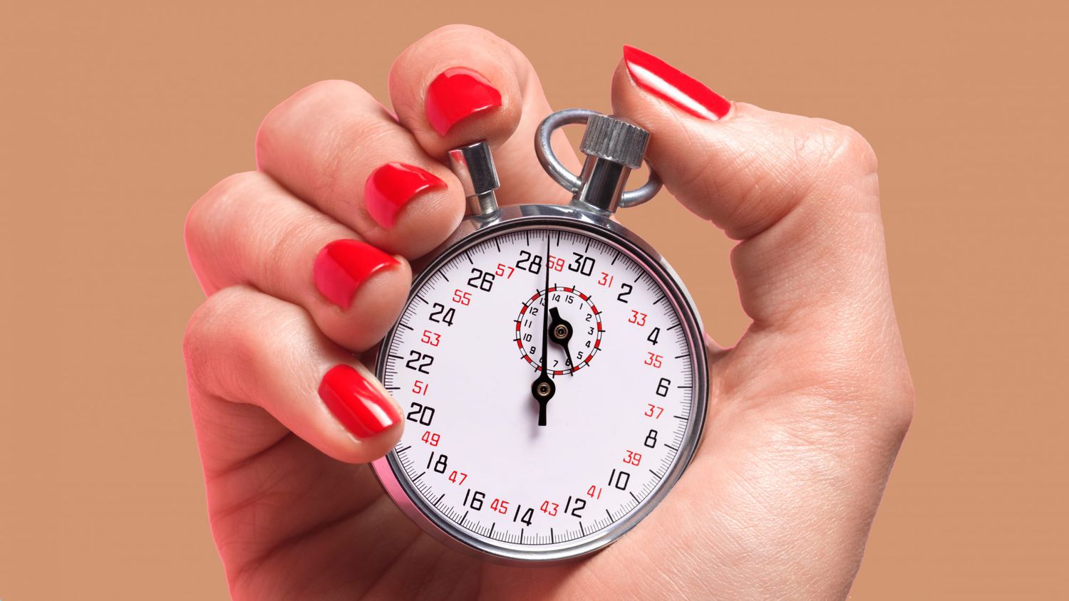 Woman holding a clock timer