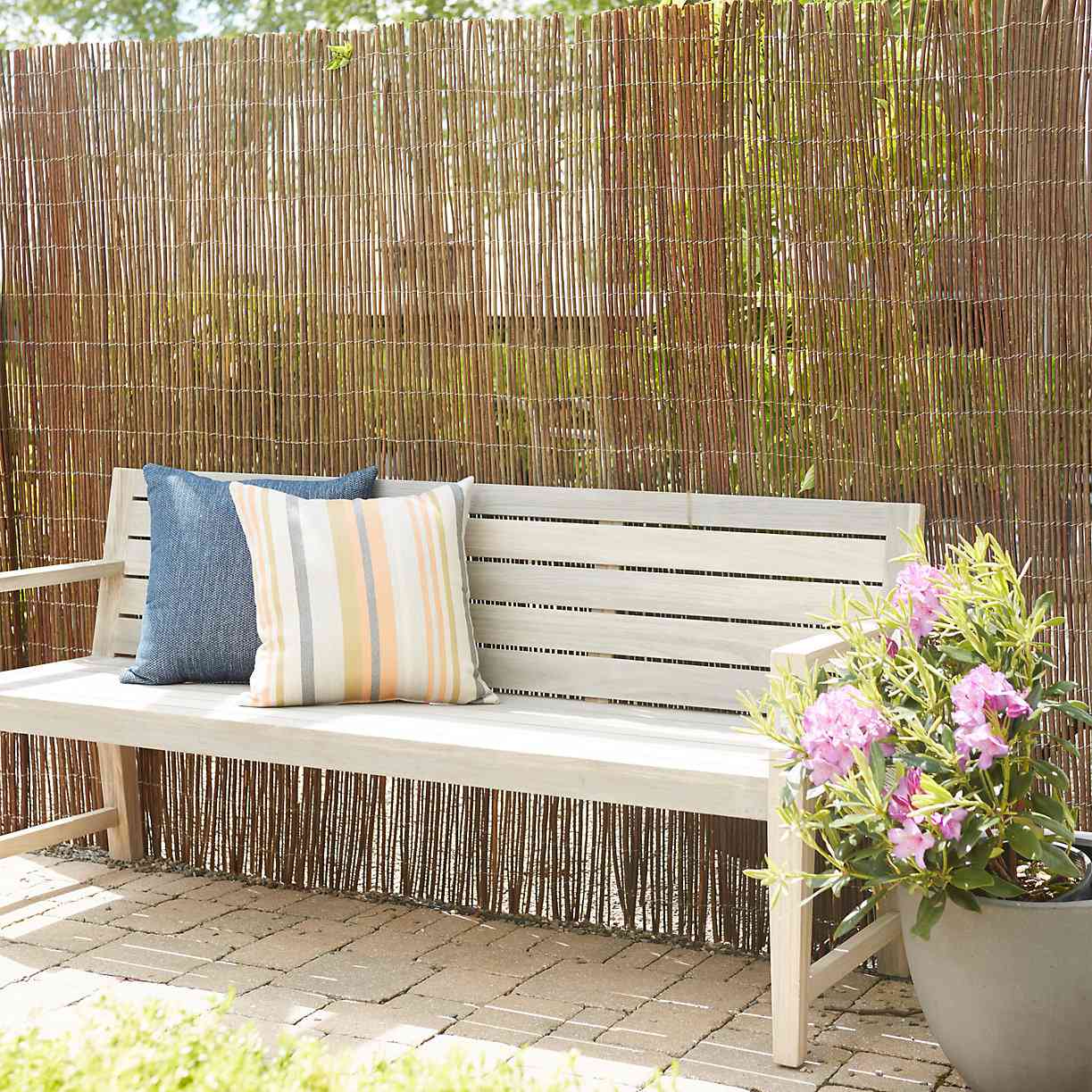 Willow fence and bench with pillows