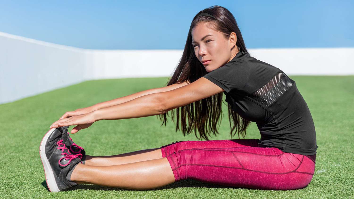 Stretching Mistakes to Avoid: woman stretching hamstrings