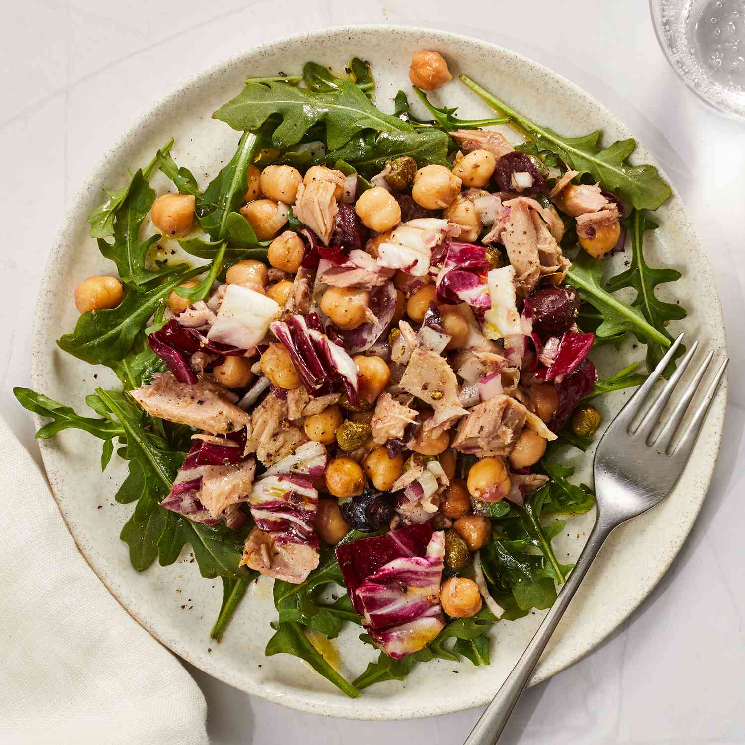 Chickpea-Tuna Salad with greens on a plate