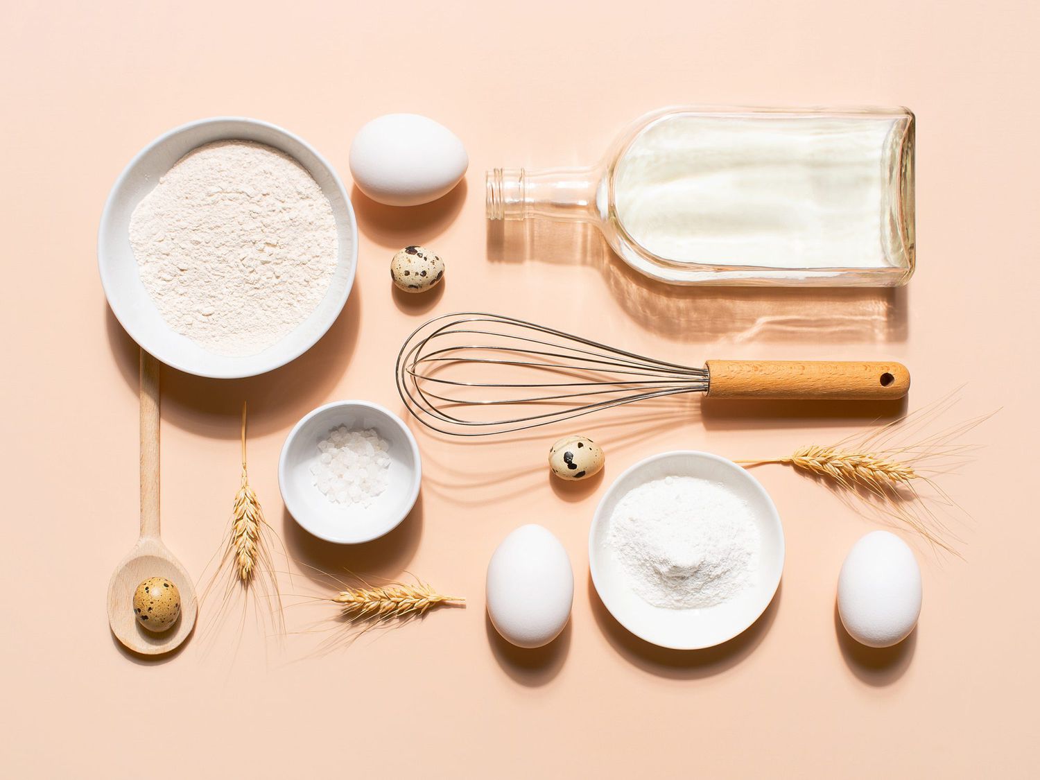 Raw ingredients for pancakes on the beige table