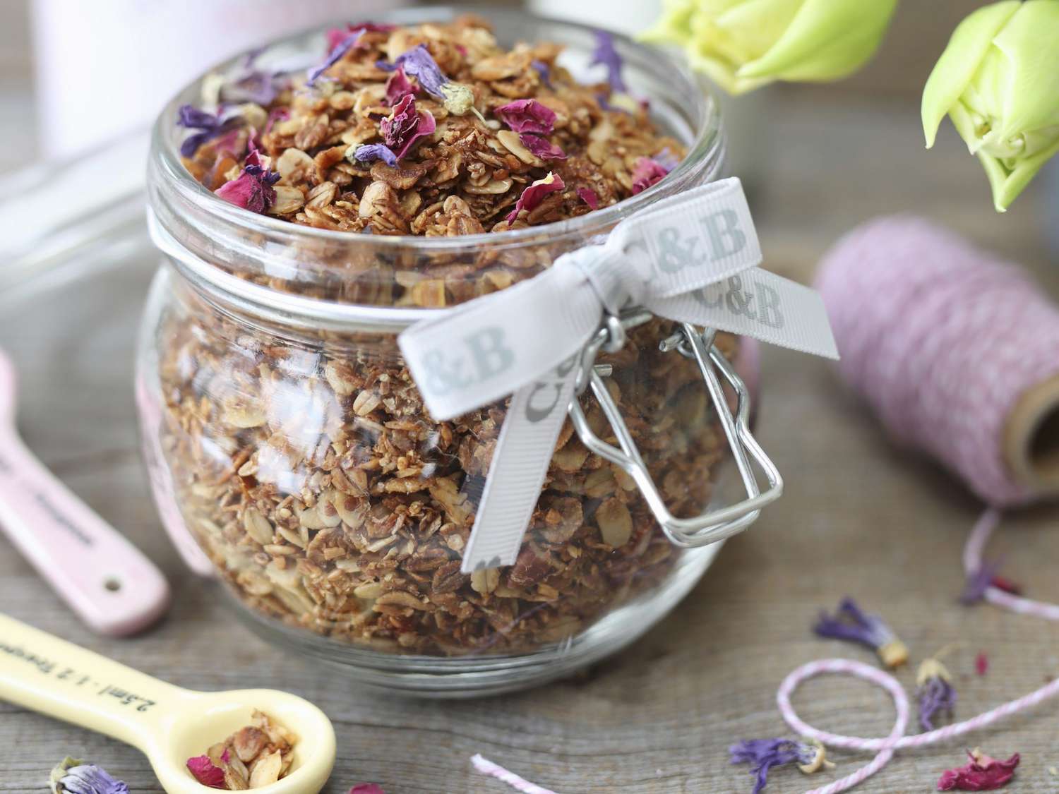 Homemade granola with coconut, sunflower and pumpkin seeds in a jar